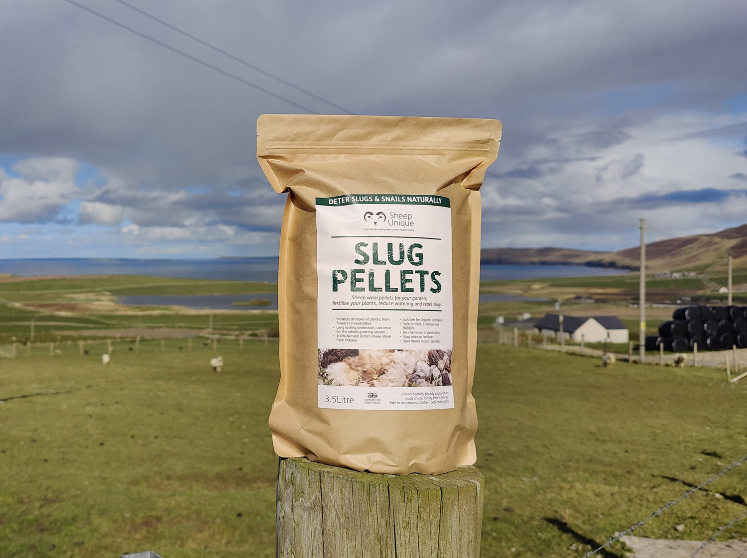 Packet of Slug Pellets on a fence post on a cloudy day