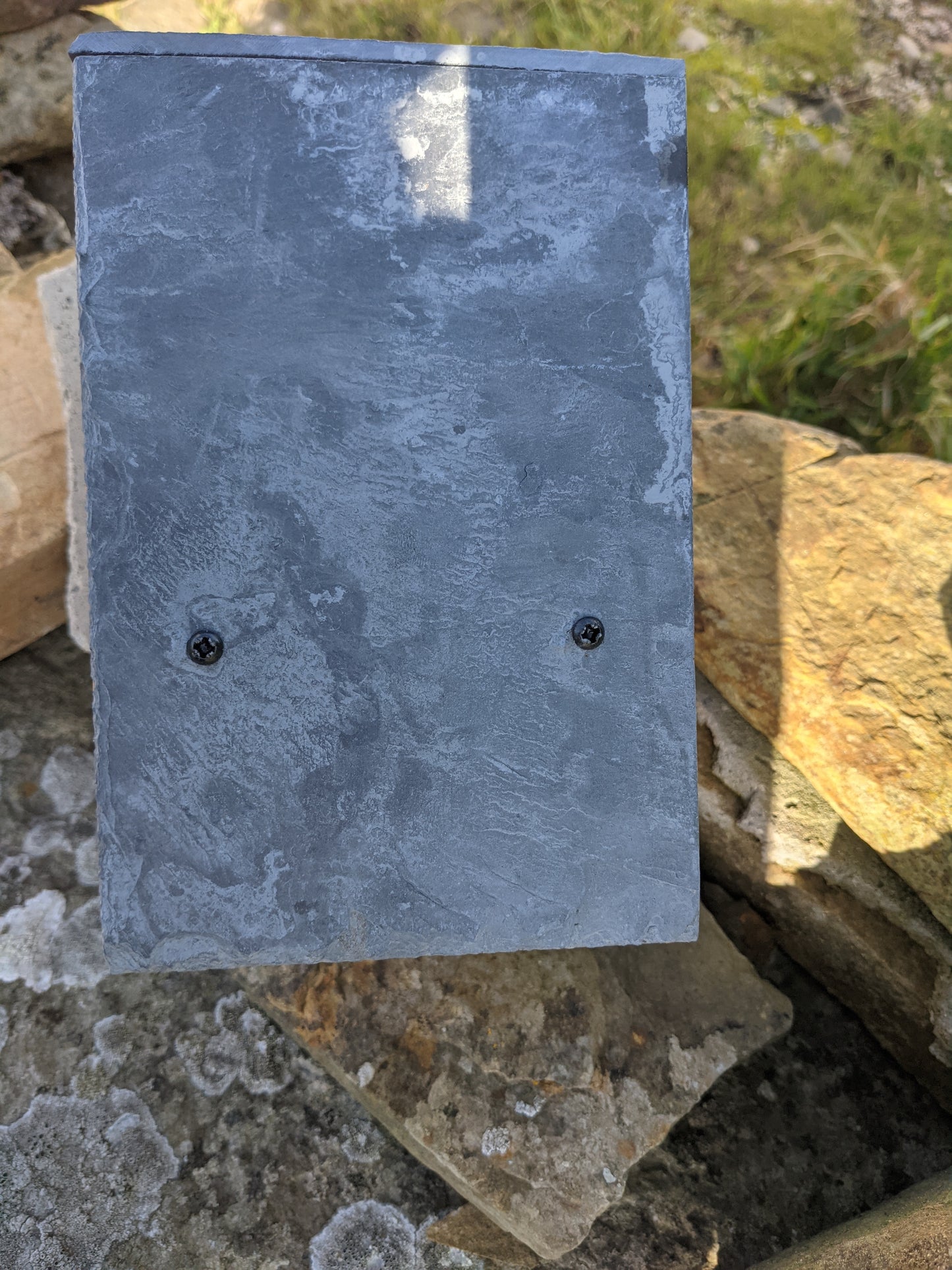 Roof of Johnston and Jeff Robin Nest box showing the natural slate securely attached.